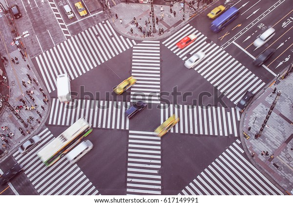 TOKYO, JAPAN -\
January 7 , 2017 : top view Car In motion blur on road of Shibuya\
Crossing,one of the busiest crosswalks in the world,Cityscape in\
the Ginza District