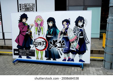 Tokyo, Japan - July 15 2021: Ad for a Demon Slayer: Kimetsu no Yaiba themed event based on the popular Japanese anime show.