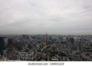 Tokyo, Japan - July 2011 - Roppongi With Tokyo Tower And Odaiba Seen From The Top Of The Mori Tower On A Cloudy Day