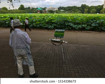 Tokyo, Japan - July, 2017: Remembering René Magritte, A Glimpse On A Nice Painter In Ueno Park And The Beautiful Lotus Flowers.