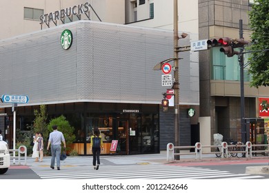 TOKYO, JAPAN - July 21, 2021: A Starbucks Coffee Shop On A Street Corner In Tokyo's Awajicho Area.