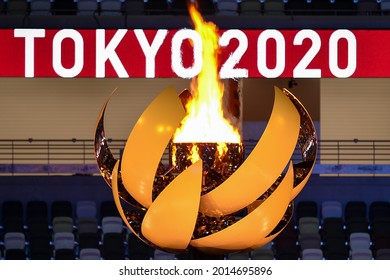 TOKYO, JAPAN - JULY 23, 2021: The Olympic Flame is seend during the Opening Ceremony of the Tokyo 2020 Olympic Games at the Olympic Stadium in Tokyo.
