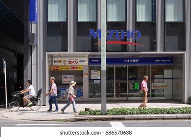 TOKYO, JAPAN - July 29th, 2017: A Kyobashi Branch Of Mizuho Bank, One Of Japan's Largest Banks. On The Left Of The Building Is A Lottery Ticket Kiosk.