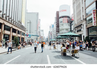 Tokyo, Japan - July 6, 2014: Ginza in Weekend. The street is blocked during weekend to allow people to spend their time leisurely.