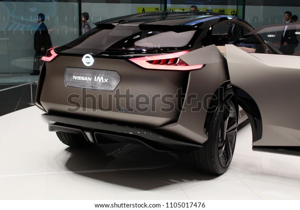 TOKYO, JAPAN - June\
1, 2018:  View of the back of a Nissan IMx, Kuro electric concept\
car at the Ginza Place Nissan Crossing showroom. The car has an\
autonomous drive mode.