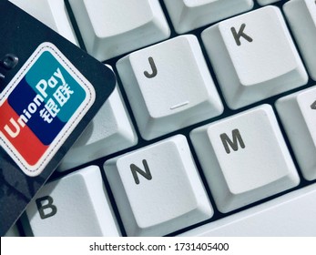 Tokyo, Japan - June, 2020: A Chinese UnionPay Credit Card On White Keyboard Background, Creative China Credit Union Pay Card Concept