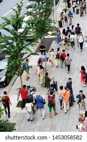 TOKYO, JAPAN - June 28, 2019: Overhead View Of A Tourists On Busy Sidewalk In Tokyo's Ginza Area.