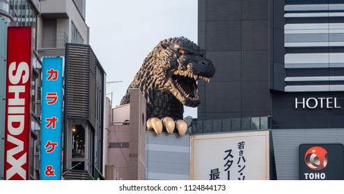 TOKYO, JAPAN - JUNE 30TH, 2018. Godzilla, popular Japanese pop cilture monster, overlooking a street in Kabukicho district, Shinjuku.