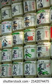 Tokyo, Japan – March 10, 2020 –  Traditional colorful barrels of sake (nihonshu) on display in a Shinto Shrine for offering to the deities that visit on Japanese New Year's day in Shibuya, Tokyo