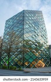 Tokyo, Japan – March 10, 2020 –  View Of The Futuristic Glass Facade Of The Prada Store On Omorensando Shopping Street At Dusk In Shibuya, Tokyo