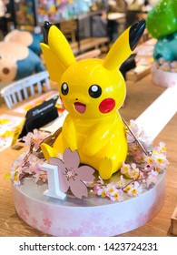 Tokyo, Japan - March 14, 2019 - A Pikachu Statue As A Decoration In The Pokemon Cafe In Nihonbashi. It Is Decorated With Cherry Blossoms During Spring Time.