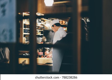 Tokyo, Japan - March 2017: Tokyo Sushi Bar Chef Street Photography Restaurant, Tokyo, Japan