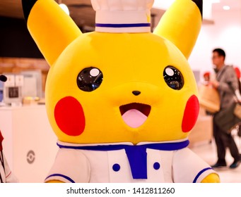 TOKYO, JAPAN - March 23, 2019 - Person Wearing A Pikachu Costume At The Pokémon Cafe In Nihonbashi