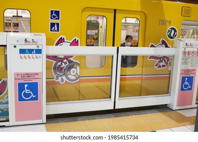 TOKYO, JAPAN - March 26, 2021: A Tokyo Subway Train With Various Versions Of The Tokyo Paralympic Mascot On It At Shibuya Ginza Line Station Platform.  The Platform Screen Doors Are Closed.