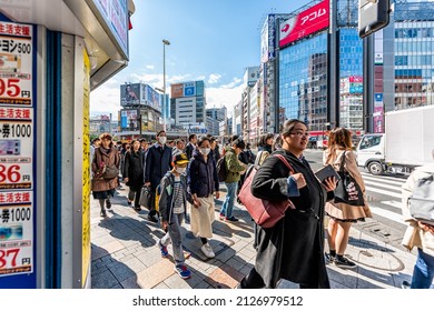 Tokyo, Japan - March 31, 2019: Shinjuku Sidewalk Street Road With Busy Crowd Many People Crossing Road In Morning Rush Hour Commute In Downtown District