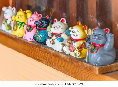 tokyo, japan - march 31 2020: Manekineko lucky cats depicting the seven gods of happiness Bishamonten, Ebisu, Daikokuten, Hotei, Jurojin, Benzaiten and Fukurokuju in the shopping street Yanaka Ginza.