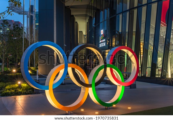 tokyo, japan\
- may 05 2021: Night view of the Olympic Rings monument at the\
entrance of the Japan Olympic Museum created for promoting the\
Tokyo Olympic and Paralympic Games in\
2021.