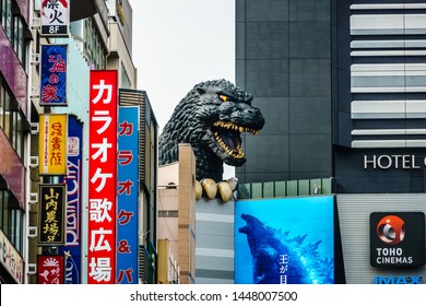 Tokyo, Japan - May 10, 2019: At Godzilla’s hometown of Tokyo, a giant Godzilla Head of the scaly menace is towering over the Toho Building in the Shinjuku Ward.