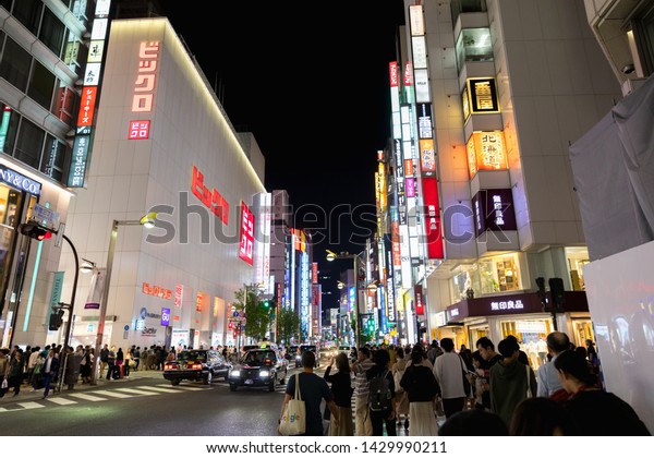 Tokyo,\
Japan - May 11 : Crowd of undefined people walking on the street\
cross-walk with car traffic in Shinjuku on May 11, 2019 in Tokyo,\
Japanese culture and shopping neon street\
concept.