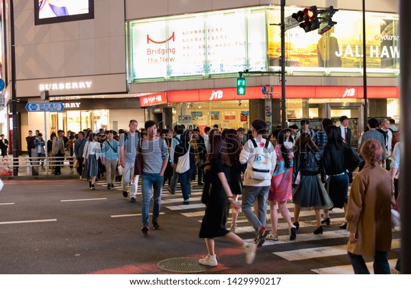 Tokyo,\
Japan - May 11 : Crowd of undefined people walking on the street\
cross-walk with car traffic in Shinjuku on May 11, 2019 in Tokyo,\
Japanese culture and shopping neon street\
concept.