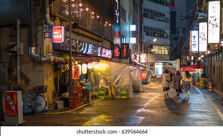 TOKYO, JAPAN - MAY 13TH, 2017. Back alley street gastro pub or locally know as izakaya in Ginza. An izakaya is a type of informal Japanese gastro pub and are casual places for after-work drinking.  