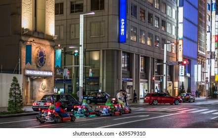 TOKYO, JAPAN - MAY 13TH, 2017. Rental Go Karts In Ginza Street. Driving A Go Kart In Public Street Offer People The Chance To Go Through Tokyo’s Busy Streets And Is A Popular Activity With Tourists.
