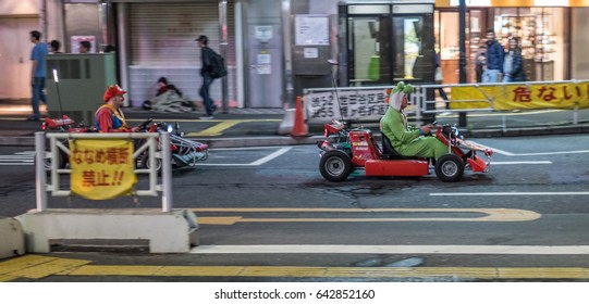 TOKYO, JAPAN - MAY 18TH 2017. Rental Go Karts In Shibuya Street. Driving A Go Kart In Public Street Offer People The Chance To Go Through Tokyo’s Busy Streets And Is A Popular Activity With Tourists.
