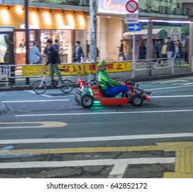 TOKYO, JAPAN - MAY 18TH 2017. Rental Go Karts In Shibuya Street. Driving A Go Kart In Public Street Offer People The Chance To Go Through Tokyo’s Busy Streets And Is A Popular Activity With Tourists.
