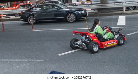 TOKYO, JAPAN - MAY 1ST, 2018. Tourists Driving Rented Go Kart In The Street Of Shibuya