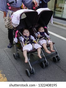 Tokyo, Japan - May 20, 2017. Twin Baby In The Stroller On Street. Since Japan Overall Population Is Shrinking Due To Low Fertility Rates, The Aging Population Is Rapidly Increasing.