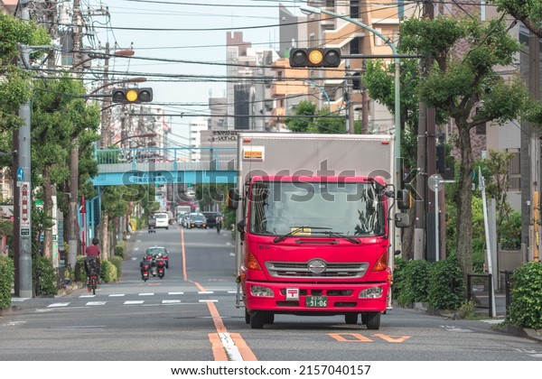 Tokyo, Japan\
- May, 2022: Close up of Japan Post truck carrying mail and\
packages to be delivered to its\
destination