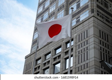 Tokyo, Japan - May 22, 2019 - Flag Of Japan Outside Tokyo Metropolitan Government Building. Located In Shinjuku, The Building Was Designed By Architect Kenzo Tange.