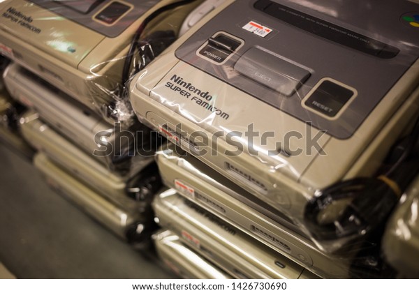 Tokyo, Japan - May\
26 2016: Super Nintendos (Super Famicoms/SNES) in a retro video\
game store in Akihabara.\
