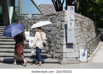 TOKYO, JAPAN - May 26, 2022: Visitors approaching the entrance to the Museum of Contemporary Art Tokyo on a sunny day.