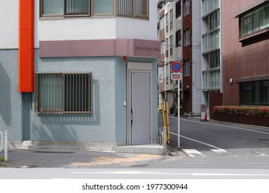 TOKYO, JAPAN - May 4, 2021: Office Building On A Street Corner In Tokyo's Ningyocho Area.