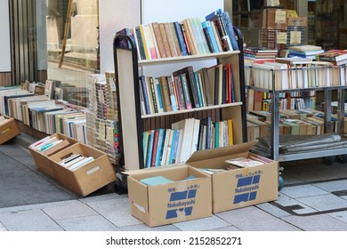 TOKYO, JAPAN - May 5, 2022: Books Displayed Outside A Used Bookstore In Tokyo's Jinbocho Area.