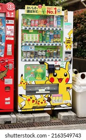 TOKYO, JAPAN - May 8, 2022: A pair of drinks vending machine on a street in Tokyo's Koto Ward. One of the machines has a Pikachu Pokemon livery and includes limited edition Ito En green tea.