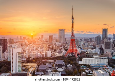 Tokyo, Japan modern urban skyline at sunset overlooking the tower.