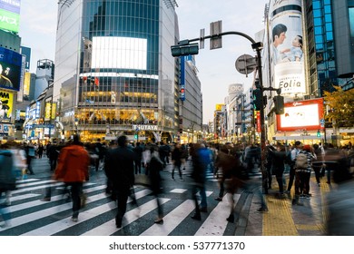 Tokyo, Japan, Nov 17, 2016: Shibuya Crossing Of City Street With Crowd People On Zebra Crosswalk In Shibuya Town. Shibuya Is A Special Ward Located In Tokyo For Shopping At Night.