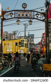 TOKYO, JAPAN - NOVEMBER 1, 2019: A Yellow Train (Seibu Shinjuku Line) Passes Through The Nogata Shopping Street In Nakano District, Tokyo. Soft Focus, Selective Focus.