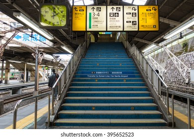 TOKYO, JAPAN - NOVEMBER 11, 2015 : JR train station platform stair with info board to transit for Narita Airport