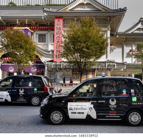 TOKYO, JAPAN - NOVEMBER 12,\
2019 : A Toyota JPN Taxi with Tokyo Olympic 2020 logo on its side,\
Japan.