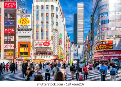 Tokyo, Japan, November 17, 2018: City Street With Crowd People On Zebra Crosswalk In Shinjuku Area In Tokyo, Japan