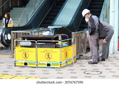 TOKYO, JAPAN - November 18, 2021: An Escalator Outside A Tokyo Metro Train Station In Edogawa Ward Which Being Inspected.