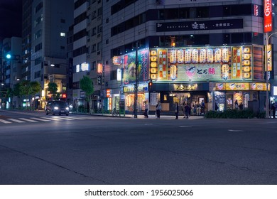 Tokyo, Japan - October 22, 2019: The Night Illumination Of Traditional Japanese Restaurants At Ningyocho Station.  Izakaya Toro Sushi, Ramen Big Echo Karaoke And Yokohama Family Ramen. Tokyo. Japan