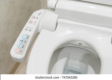 TOKYO, JAPAN - October  26, 2017: Modern high tech toilet with electronic bidet in Japan. Industry leaders recently agreed on signage standards for Japanese toilet bowls.