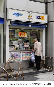 TOKYO, JAPAN - October 26, 2018:  A Customer At A Lottery Ticket Store In Akabane In Tokyo.