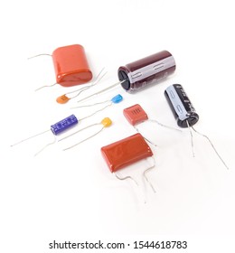 Tokyo, Japan - October 29, 2019 : Different type of capacitor on white background. Ceramic and electrolytic capacitor.