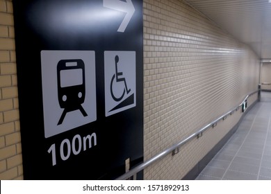 Tokyo, Japan - October 30, 2019 : Close Up View Of An Information Signage Showing The Direction To The Train Station With Disabled Access At Narita Airport 