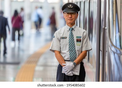 TOKYO, JAPAN - OCTOBER 30, 2019: Seibu Shinjuku Railway Station In Shinjuku, Tokyo, Japan, Train Driver Is Waiting To Depart. Portrait.